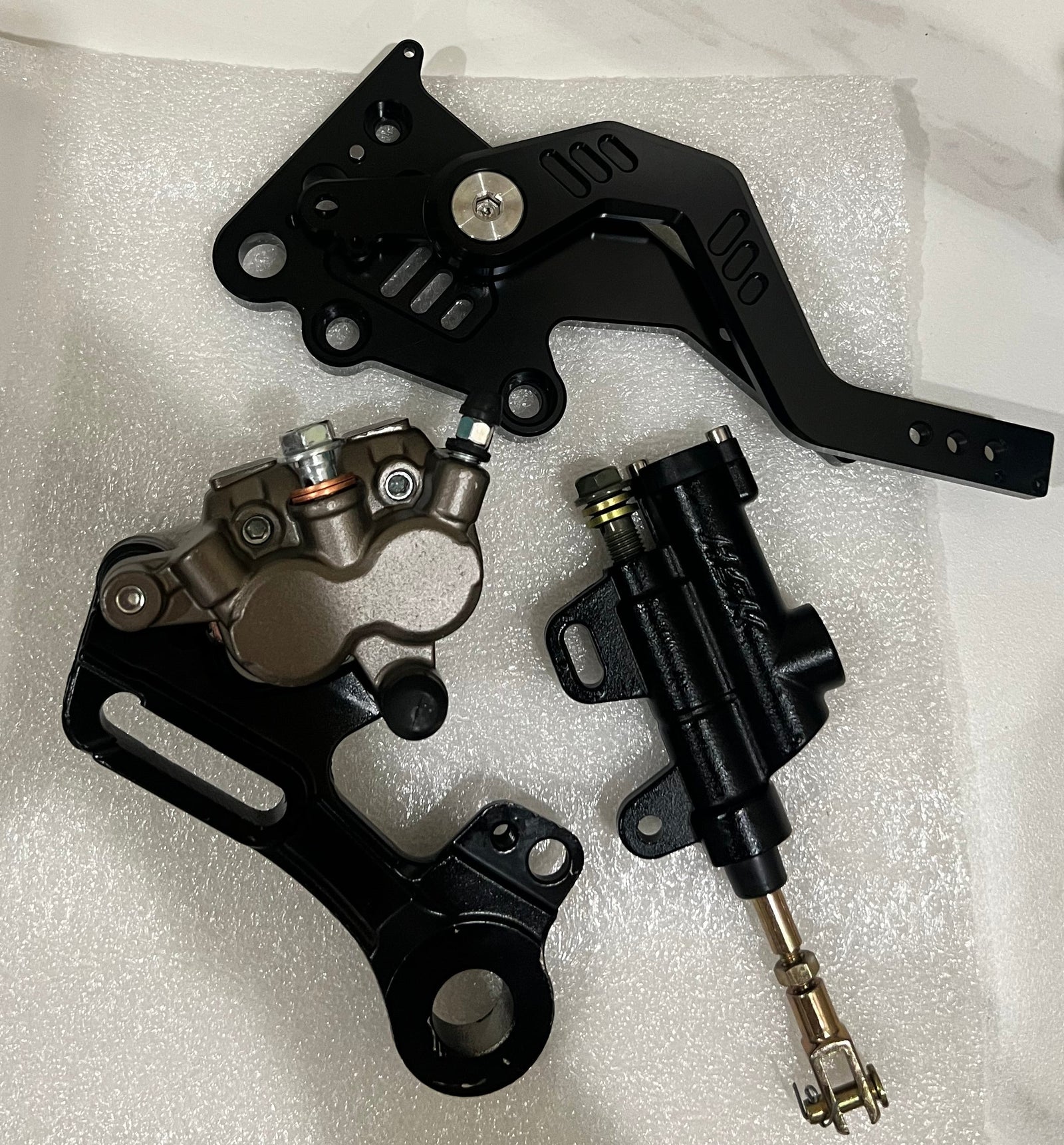 Black Surron Ultra Bee V2 footbrake front view